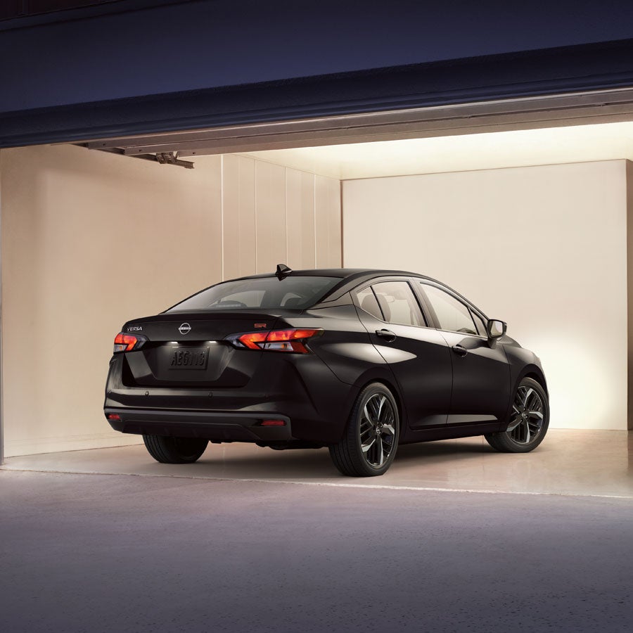 2025 Nissan Versa parked in a well-lit and otherwise empty garage